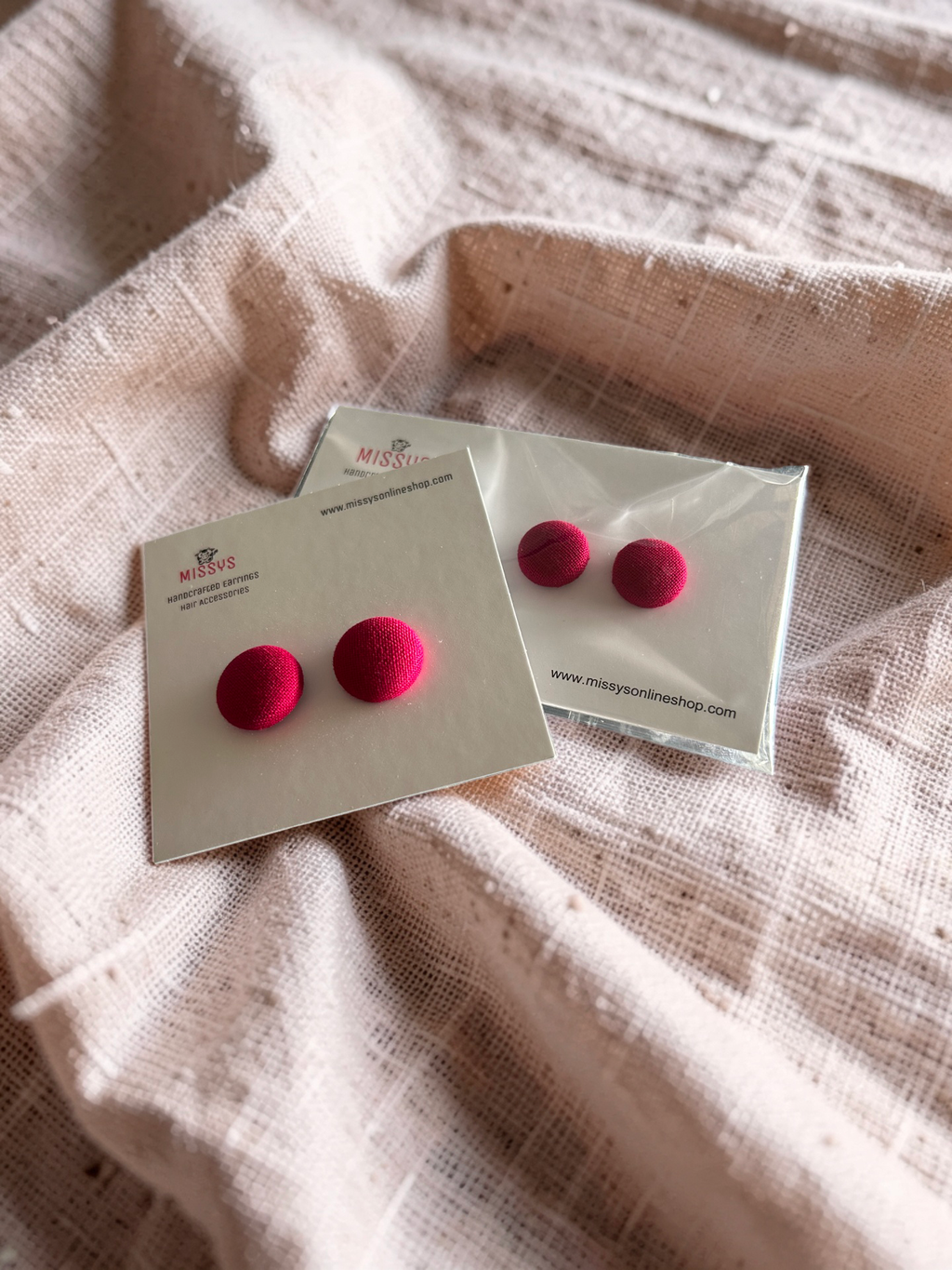 Crimson fabric button