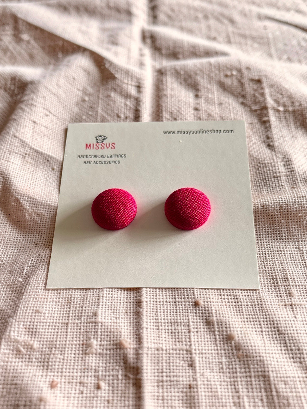 Crimson fabric button