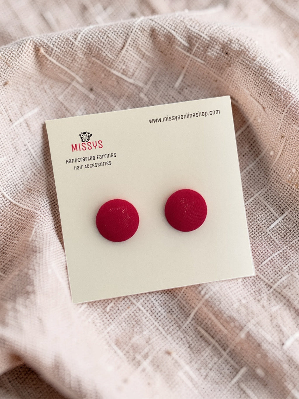 Crimson fabric button